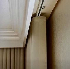 the corner of a room with a door handle