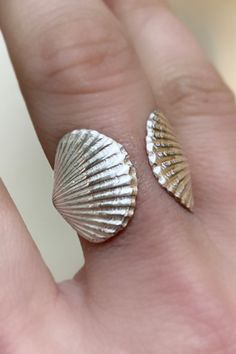 Twin sterling silver Euvola shells greet each other as they cradle your finger. Scallop seashells represent love and beauty a la the goddess Aphrodite. In Botticelli's famous painting, the Birth of Venus, the goddess is shown being carried from the sea on a scallop shell. Available in sterling silver of gold plate silv Silver Shell Gift, Silver Shell-shaped Ring For Gift, Silver Shell Rings For Gift, Silver Shell Rings For Beach, Silver Shell-shaped Rings For Beach, Unique Silver Shell As A Gift, Unique Silver Shell Rings, Goddess Aphrodite, Birth Of Venus