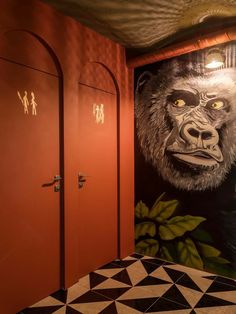 the bathroom is decorated with an image of a gorilla