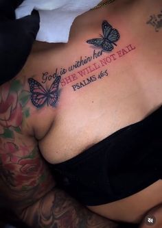 a woman with tattoos on her chest has a tattoo that reads, god is within her she will not fail