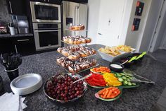 a kitchen counter topped with lots of food