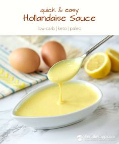 a spoon full of liquid being poured into a bowl with lemons and eggs in the background