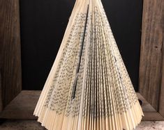 an open book sitting on top of a wooden table