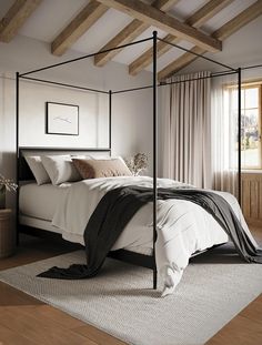 a bedroom with a four post bed and white sheets on the bed is decorated in neutral colors