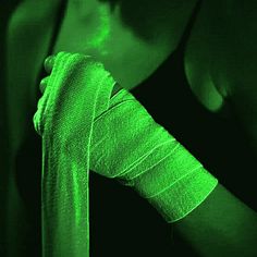 a woman with her arm wrapped around a green tie