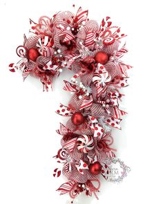 a red and white christmas wreath with candy canes