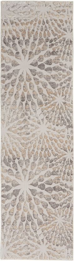 a beige and grey rug with an intricate design