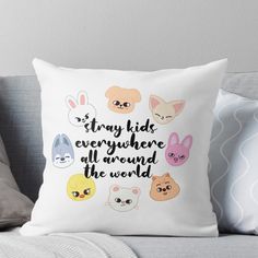 a throw pillow with the words, stay kids everywhere around the world in different colors