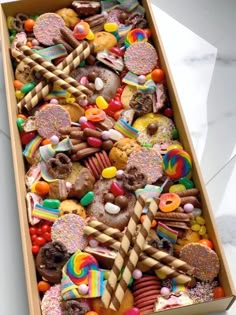 a box filled with lots of different types of candies