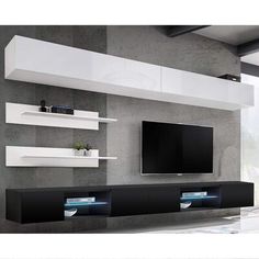 a modern living room with an entertainment center and large television on it's wall