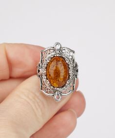 Natural Authentic Amber Silver Ring 925 Sterling Silver Handmade Artisan Crafted Ornate Filigree Ring Material: 925 Sterling Silver Genuine Natural Amber Gemstone Dimensions : 14 mm x 10 mm Ring Face Length: 1 inches Width: 0.60 inches Comes with a gift pouch and box Free Domestic Shipping Excellent quality, have sold in the USA, Canada, Italy, Germany and the UK, and received hundreds five star reviews. It is a gift that will create memories for years to come. Our fine silver jewelry is Made in Amber Gemstone, Fine Silver Jewelry, Create Memories, Natural Amber, Filigree Ring, Gift Pouch, Artisan Craft, Handmade Artisan, Jewelry Gift Box