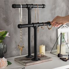 Whether organizing your personal collection at home or showcasing merchandise in a boutique, this jewelry rack is an excellent decorative storage solution and is ideal for placement on your dresser, table, or countertop surface. Williston Forge | Williston Forge Decorative Black Pipe Jewelry Stand Organizer 18.35 H x 6.65 W x 11.77 D in black / brown / grayWood / Metal in Black;brown | 18.35" H X 6.65" W X 11.77" D | Wayfair Jewerly Display, Wood Jewelry Display, Dresser Table, Diy Jewelry Display, Jewelry Rack, Jewelry Displays, Black Pipe, Necklace Stand, Craft Show Displays