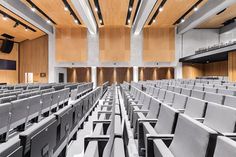 an empty auditorium with rows of seats in it