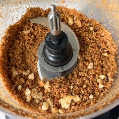 a food processor filled with chopped meat and spices