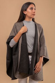 100% Baby Alpaca Multicolored Cape in contrasting tones. - Soft to the touch - Lightweight and warm at the same time. Length: 50” (Including Fringes) Width: 63” Weight: 1.32 lbs Baby Alpaca is an especially soft grade of Alpaca. Alpaca fiber stands out for being as soft as Cashmere, but warmer, lighter, and more durable. Alpaca is also water repellent and keeps you warm even when wet. Womens Sweater Coats, Winter Trip, Capes & Ponchos, Poncho Tops, Alpaca Fiber, Mens Pajamas, Baby Alpaca, Sweater Coats, Blouse Dress