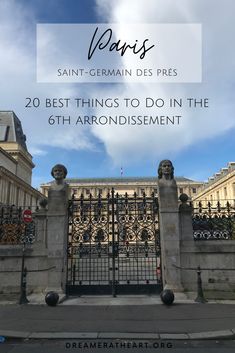 an iron gate with the words paris written over it in front of a blue sky