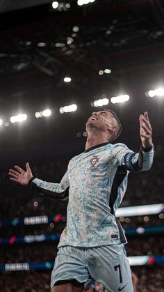 a man is jumping up in the air to catch a frisbee at a sporting event