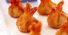 several small pieces of fried food on a plate