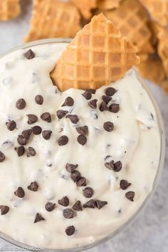 chocolate chip waffles and cream dip in a glass bowl with crackers on the side