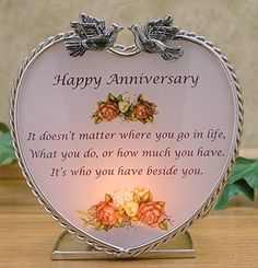 a heart shaped glass with two birds on it and the words happy anniversary written below