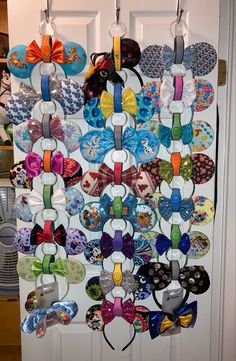 the door is decorated with many different types of shoes and headbands hanging from hooks