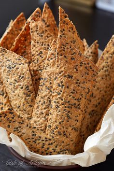 a bowl filled with crackers sitting on top of a table