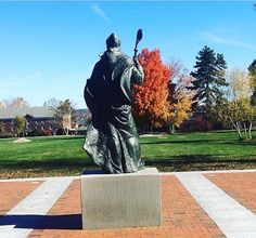 a statue of a man holding a baseball bat