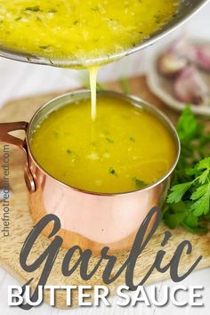 garlic butter sauce being poured into a pot with parsley on the side and text overlay that reads garlic butter sauce