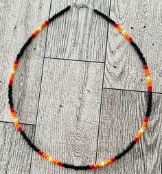 Sunset Necklace with seed beads. Gift Heishi Beaded Necklaces With Black Beads, Black Beaded Heishi Beads Necklace, Orange Beaded Necklaces With Oval Spacer Beads, Orange Necklace With Black Round Beads, Orange Heishi Beads Necklace, Seed Bead Necklace Ideas, New Mexico Sunset, Sead Bead Necklace, Mexico Sunset