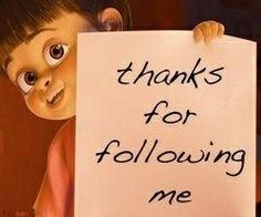 a child holding a sign that says thanks for following me