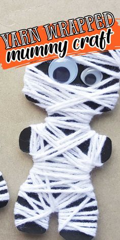 yarn wrapped up to look like a dummy with eyes and mouth on top of it