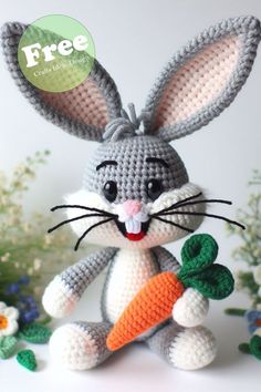 a crocheted bunny holding a carrot with the caption free crochet pattern