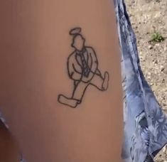 a person with a tattoo on their leg that has a drawing of a man holding a baseball bat