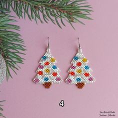 the beaded christmas tree earrings are on display