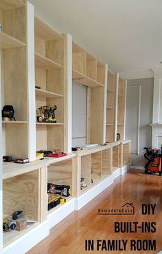 a room with wooden shelves filled with toys