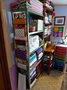 a room filled with lots of different types of fabrics