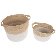 two white and brown baskets sitting next to each other