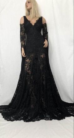 The luxurious lace dress in black is made from stretch lace and stretch satin, featuring a deep V front and back.  The standard length for this design is 164 cm in the front and 185 cm in the back, but if you want the dress can be customized according to your exact measurements. Contact us and you will receive a list of the necessary measurements. Production time for this handmade dress is 6-10 weeks, with possible variations depending on the season and production volume.  Shipping is free and takes 5-10 business days, or you can upgrade to express shipping for faster delivery.  Please note that we do not offer refunds or exchanges, as all sales are final. However, if you need assistance with your order, don't hesitate to contact us.   To ensure the best style for your body type, we recomm Black Wedding Dress Boho, Dress Boho Wedding, Black Wedding Dress, Wedding Dress Boho, Wedding Dress Lace, Boho Wedding Dress Lace, Handmade Dress, Black Wedding Dresses, Dress Boho