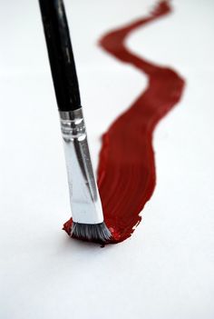 a brush with red liquid coming out of it