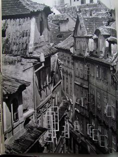 an old black and white photo of some buildings