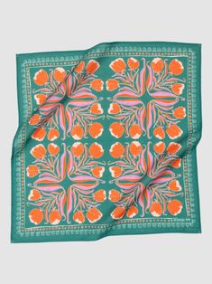 an orange and green floral design on a teal colored silk pocket square with red, white, and pink flowers