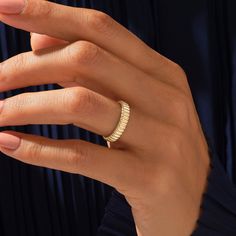 a woman's hand with a ring on it