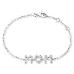 A heartfelt gift, this bracelet features a charm that displays "Mom" in sparkling white lab-created sapphires. Styled in classic sterling silver, the cable chain measures 7.5 inches and secures with a lobster clasp. Mom Bracelet, Moms Bracelet, White Lab, Kay Jewelers, Bracelet Clasps, Sapphire Stone, Heartfelt Gifts, Bracelet Designs, Cable Chain