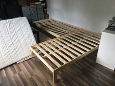 the bed frame is made up and ready for us to use