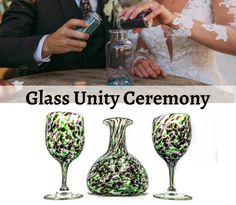 a man and woman in wedding attire standing next to each other at a table with wine glasses