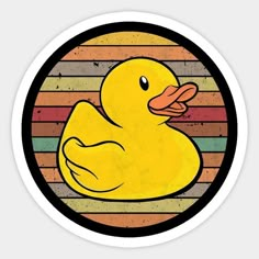 a yellow rubber ducky sitting on top of a rainbow colored striped circle sticker