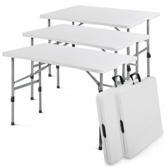 three white folding tables with one carrying case