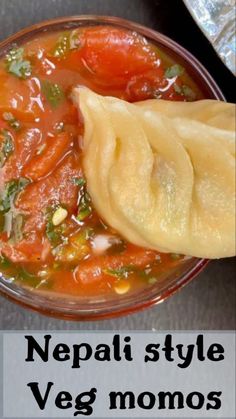 a bowl filled with vegetable soup and dumplings