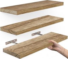 three wooden shelves are shown with one hand holding the shelf and another is pointing at it