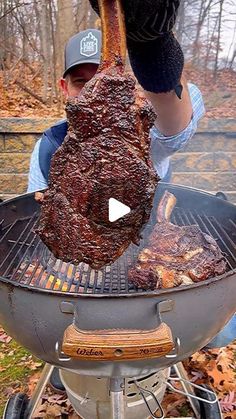 a man is cooking meat on an outdoor grill